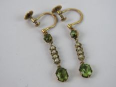 A delightful pair of Edwardian peridot and seed pearl screw back earrings, stamped 9ct, 2.