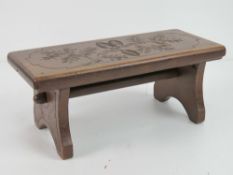 A delightful folding stool having twin solid hinged legs with locking drop down spindle,