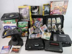 A large collection of video game consoles including two Sega Mega Drive, Playstation, Xbox,
