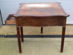 A shaped 19th century fold over games table having single pull out support,