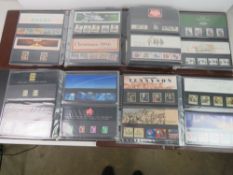 Four albums of Royal Mail Presentation pack stamps.