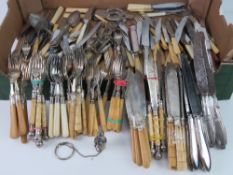 A large quantity of assorted flatware.