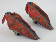 Lotus Feet Shoes; a pair of 19th century Chinese embroidered silk foot binding shoes,