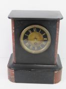 A black slate architectural mantle clock, a/f - naive restoration to top.