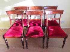 A set of six (4 +2) mahogany bar back dining chairs having red velvet drop in seats,