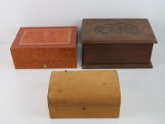 A vintage leather covered jewellery box, together with a contemporary jewellery box and another.