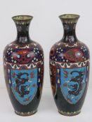 A pair of early 20thC cloisonné Canton enamel vases in blues and reds, one a/f, each standing 24.