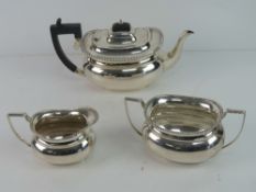 A HM silver tea service bearing presentation inscription in Welsh that translates to Gifted by