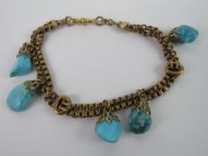 A late Victorian / Edwardian 9ct gold bracelet having buckle pattern spacers over two rows of chain,