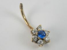 A 9ct gold piercing having blue and white floral cluster, 1.1g.