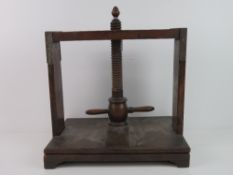 A 19th century mahogany book press, with helix and two handles, acorn finial top, 35.