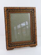 Unusual Folk Art Tramp Art frame - a five tiered polychromed and brass stud decorated portrait