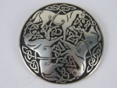 A St. Justin pewter brooch having three horses and Celtic knot design upon, 5.2cm dia.