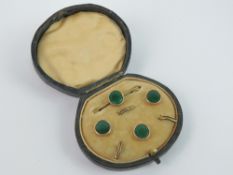 A delightful green enamelled brooch and three button set within original fitted box,