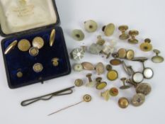 A quantity of assorted vintage shirt studs and cufflinks, a yellow metal tie pin,