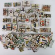 A large quantity of assorted Players and Wills vintage cigarette cards.