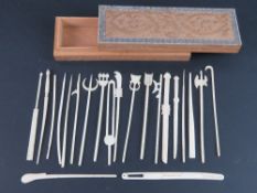 A quantity of finely made 19th century ivory and detailed miniature weapons being swords, tridents,