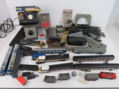 A quantity of Hornby model railway carriages, control units, etc. Some in original packaging.