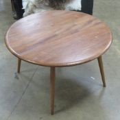 A 1960s Ercol style coffee or side table, approx 75cm dia.