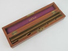 A mahogany box containing a quantity of Stanley's Engine Divided Scale boxwood rulers,