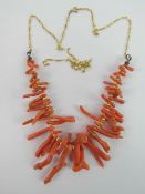 An antique coral branch necklace remounted on modern 9ct gold chain (extra chain included).
