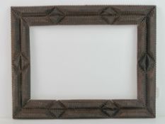 Folk Art / Tramp Art frame - an unusual circa 1900 hand carved multi sectional stained pine picture