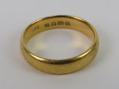 A 22ct gold ring, D shaped plain band, hallmarked 22, size M, 5.1g.