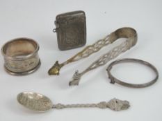 A quantity of assorted silver and white metal items; vesta case, napkin ring, bangle,
