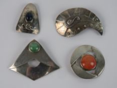1960's Danish style Modernist jewellery; four white metal brooches,