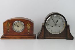 A good Art Deco Walnut overmantle clock having silvered dial with Arabic numerals,