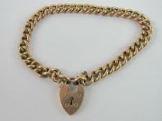 A 9ct rose gold curb link charm bracelet having heart padlock clasp, stamped 9c, 9.3g.