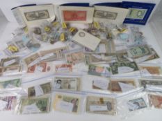 A large quantity of assorted world coins and bank notes including WWII period for Burma, Algeria,