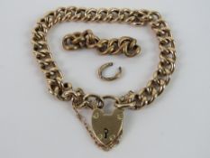 A vintage 9ct gold charm bracelet with heart padlock clasp, stamped 9c throughout,