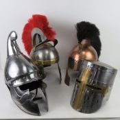Re-enactors Roman/ Medieval helmets. Four items.