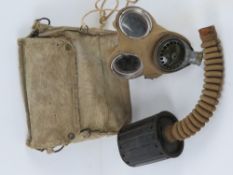 A WWII British rare filtered service gas mask and bag with eye glasses (extremely rare filter,