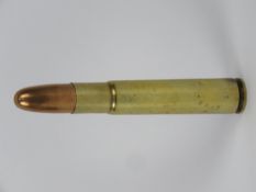 An inert Gibbs .505 bullet approx 10.7cm in length.