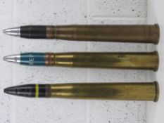 Three inert 40mm Bofors rounds each standing 45cm high.