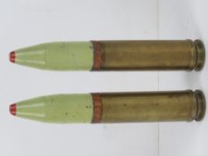 Two inert British 30 x 113mm Aden rounds, each measuring 20cm in length.