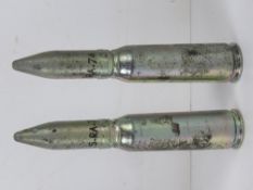 Two inert US M5 1A2 20mm drill rounds, each approx 17cm in length.