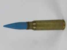 An inert 20 x 102 Vulcan round 17cm in length.