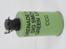 An inert British L68A1 smoke grenade (green).