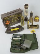 A quantity of inert brass shell casings, fuse head, mark III sten magazine, cartridge case, etc.