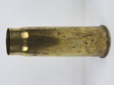 A WWI 1918 brass shell case standing 29.5cm high.