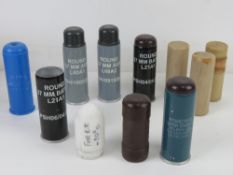A quantity of assorted inert baton rounds and inserts. Eleven items.