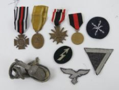 A quantity of assorted reproduction patches, medals and dress dagger knot.