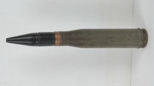 An inert 23mm Russian APT 23.5cm in length.