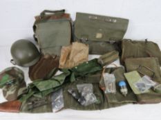 A quantity of assorted militaria inc machine gun cover, gunners kit pouches, map case,