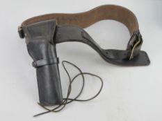 A Western holster and belt with empty shell casings.