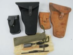 Two Skorpion holster with magazine pouches and a cleaning kit.