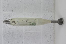 An inert 81mm mortar smoke round (white) 66.5cm in length.